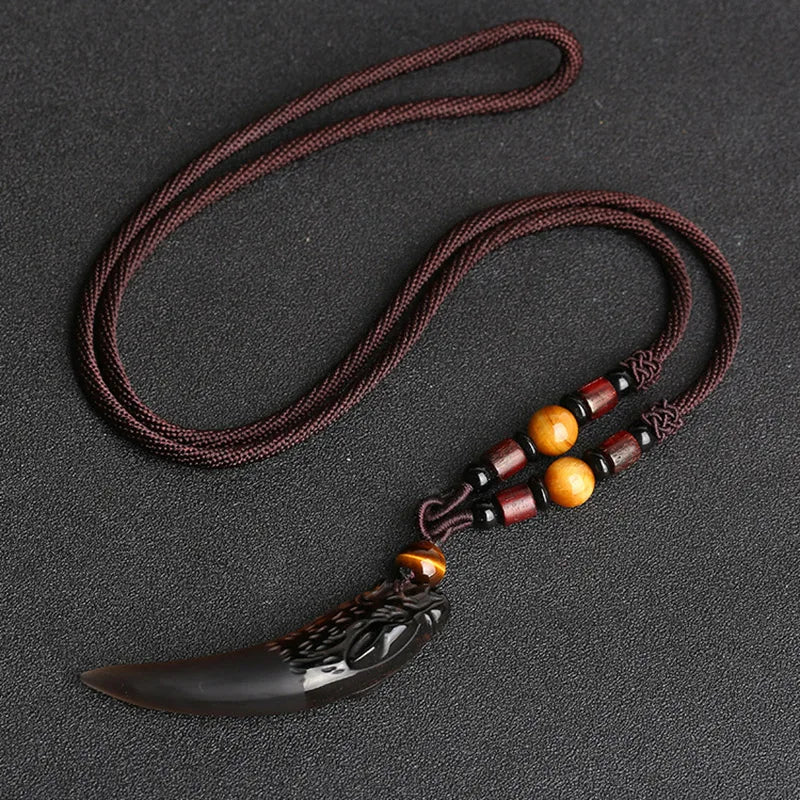 Black natural stone and ice wolf tooth pendant necklace