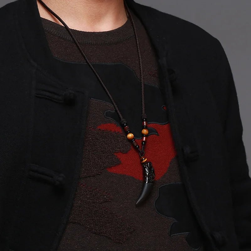Black natural stone and ice wolf tooth pendant necklace