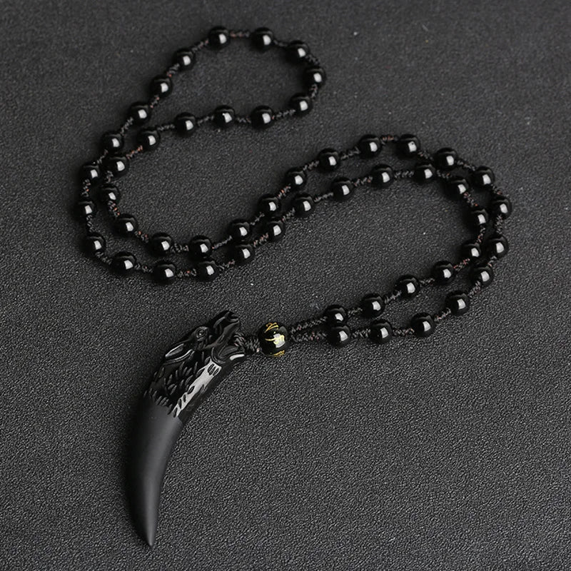 Black natural stone and ice wolf tooth pendant necklace