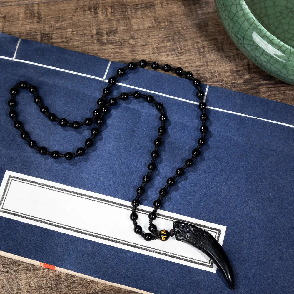 Black natural stone and ice wolf tooth pendant necklace